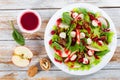 Salad of apple, spinach, mini mozzarella balls, lettuce leaves, Royalty Free Stock Photo