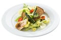 Salad with artichokes, cherry tomatoes, lettuce and rye bread on white plate isolated on white background