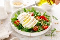 Salad with arugula, mozzarella cheese and pine nuts. Breakfast. Ketogenic, keto or paleo diet. Healthy food.