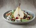 Salad with arugula, pear, blue cheese and cranberries, on a pastel plate