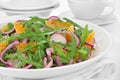 Salad with arugula, radish and tangerine