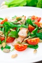 Salad with arugula, salmon and cherry tomato