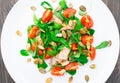 Salad with arugula, salmon and cherry tomato