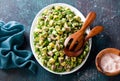 Salad with avocado, cucumbers, canned sardines and herbs