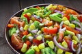 Salad with avocado, tomato, paprika and corn