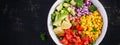 Salad with avocado, tomatoes, red onions and sweet corn in bowl. Royalty Free Stock Photo