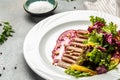 Salad with baked duck, green salad mix and berry sauce Royalty Free Stock Photo