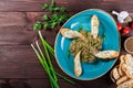 Salad baked eggplant with green onions, garlic, herbs, croutons and tomatoes on dark wooden background. Ingredients on table. Royalty Free Stock Photo