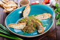 Salad baked eggplant with green onions, garlic, herbs, croutons and tomatoes on dark wooden background. Royalty Free Stock Photo