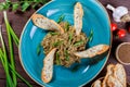 Salad baked eggplant with green onions, garlic, herbs, croutons and tomatoes on dark wooden background. Royalty Free Stock Photo