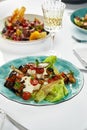 Salad with baked eggplant and ricotta cheese, close-up, fresh taste of soft ricotta cheese with lettuce leaves and Royalty Free Stock Photo