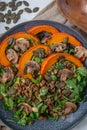 Salad with baked pumpkin, lentils on a table