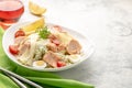 Salad with baked salmon. A large portion of salad with red fish, fresh vegetables, eggs, cherry tomatoes and lemon Royalty Free Stock Photo