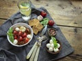 Salad. Baked tomato, basil, garlic with mozzarella cheese, ceramic dishes. cooking, cooked dish, top view