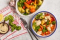 Salad with baked vegetables with tahini in white plate, white ba Royalty Free Stock Photo