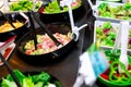 Salad bar buffet at restaurant. Fresh salad bar buffet for lunch or dinner. Healthy food. Fresh green and purple lettuce in white Royalty Free Stock Photo