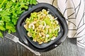 Salad of beans and olives in plate on board top Royalty Free Stock Photo