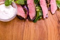 Salad with beef slices, grilled vegetables - eggplant, corn, mushrooms, sauce on a wooden board, dish Royalty Free Stock Photo