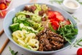 Salad with beef teriyaki and fresh vegetables - tomatoes, cucumbers, paprika, arugula and lettuce Royalty Free Stock Photo