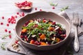 Salad with black rice, baked pumpkin, pomegranate seeds, arugula and nuts