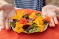Salad of boiled beets, nasturtium and walnuts. Nice vegetarian dish. Close up. Blur and selective focus