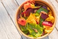 Salad of boiled beets, nasturtium and walnuts. Nice vegetarian dish. Close up. Blur and selective focus