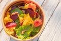 Salad of boiled beets, nasturtium and walnuts. Nice vegetarian dish. Close up. Blur and selective focus