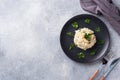 Salad of boiled rice, red fish pink salmon eggs and greens on a plate. Copy space Royalty Free Stock Photo