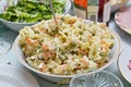 A salad bowl with Russian salad (Olivier) on a festive table