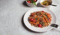 Salad with buckwheat and vegetables on a white plate