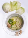 Salad with cabbage leaves and mushrooms in white bowl. close up