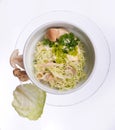 Salad with cabbage leaves and mushrooms in white bowl. close up