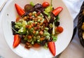 Salad with candied beans, strawberry and bacon marinated