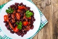 Salad with cherry tomatoes and red beans in spicy tomato sauce Royalty Free Stock Photo