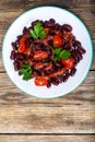 Salad with cherry tomatoes and red beans in spicy tomato sauce Royalty Free Stock Photo