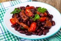 Salad with cherry tomatoes and red beans in spicy tomato sauce Royalty Free Stock Photo