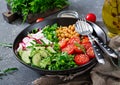 Salad of chickpeas, tomatoes, cucumbers, radish and greens. Royalty Free Stock Photo