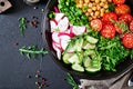 Salad of chickpeas, tomatoes, cucumbers, radish and greens. Royalty Free Stock Photo