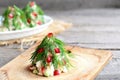 Salad Christmas tree. Salad with meat, mushrooms, cucumbers and eggs decorated with dill. Christmas recipe. Old wooden background