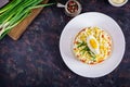 Salad of cod liver with eggs, cucumbers, potatoes, green onion