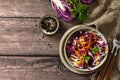 Salad Cole Slaw. Autumn Cabbage salad in a bowl on a rustic wooden table. Flat lay top view. Royalty Free Stock Photo