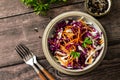 Salad Cole Slaw. Autumn Cabbage salad in a bowl on a rustic wooden table. Flat lay top view. Royalty Free Stock Photo