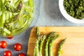 Salad components, asparagus, cherry tomatoes, pesto