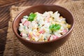 Salad with corn and crab sticks in bowl on wooden table Royalty Free Stock Photo