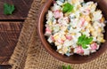 Salad with corn and crab sticks in bowl on wooden table Royalty Free Stock Photo