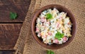 Salad with corn and crab sticks in bowl on wooden table Royalty Free Stock Photo