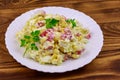 Salad with crab sticks, sweet corn, chinese cabbage, eggs and mayonnaise on wooden table Royalty Free Stock Photo