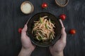 Salad with daikon radish, green onions, honey and red chili powder. Asian salad. Flat lay. Space for text. Dark background Royalty Free Stock Photo