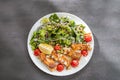salad dish with slices of baked fried salmon with vegetables Royalty Free Stock Photo