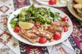 salad dish with slices of baked fried salmon Royalty Free Stock Photo